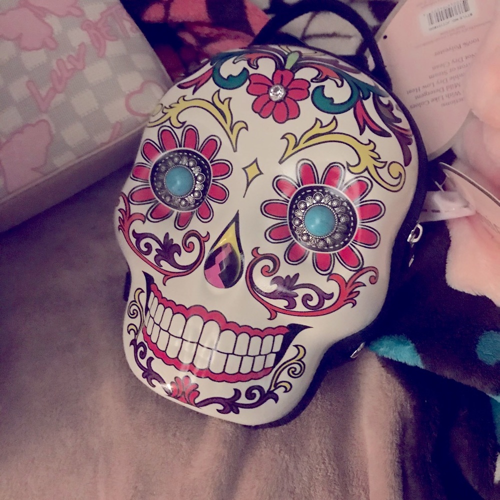Two skull backpack/purses